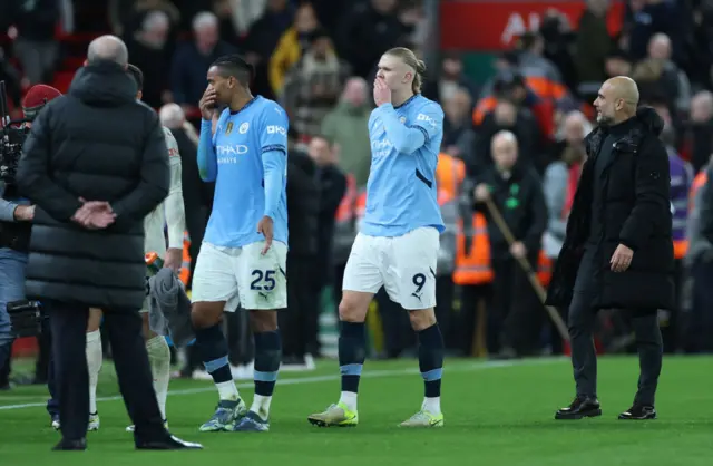 Manuel Akanji and Erling Haaland after Liverpool defeat