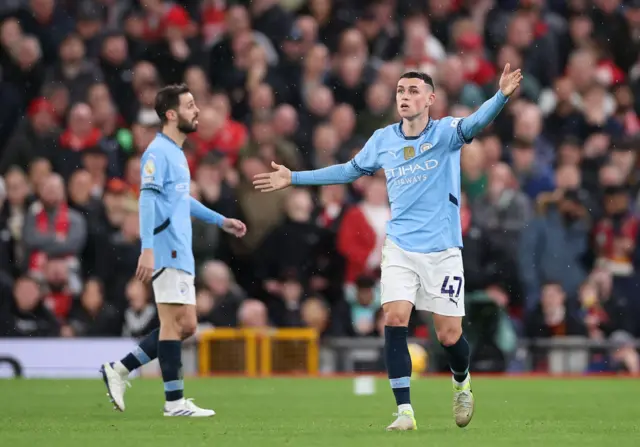 Phil Foden gestures in the game against Liverpool