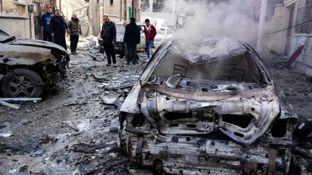 the scene of a Syrian regime airforce strike that targeted a neighbourhood in Syria's rebel-held northern city of Idlib on December 1, 2024.