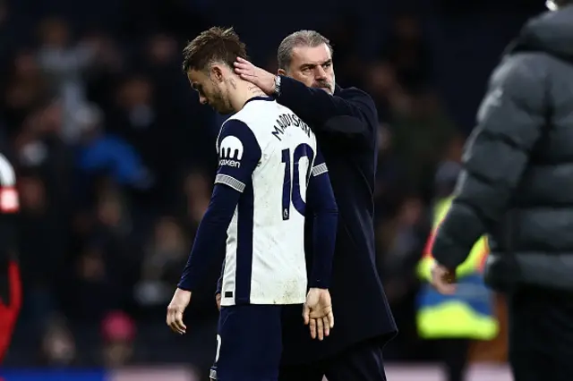 Ange Postecoglou consoles Tottenham Hotspur's English midfielder #10 James Maddison.