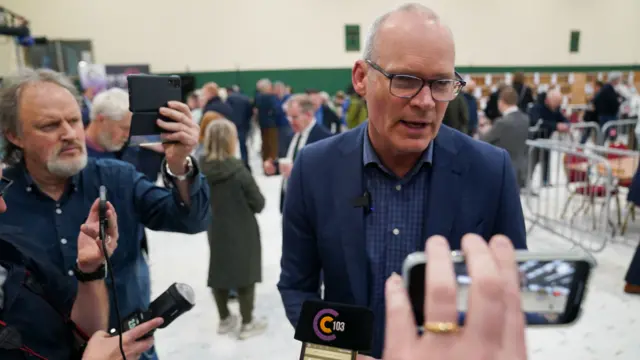 Simon Coveney being interviewed by media