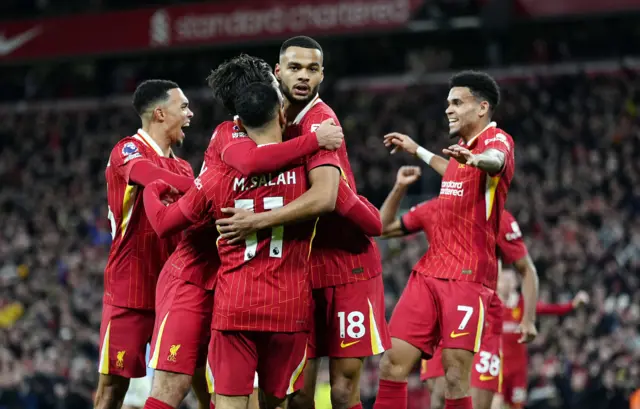 Liverpool's Cody Gakpo celebrates scoring their side's first goal of the game.