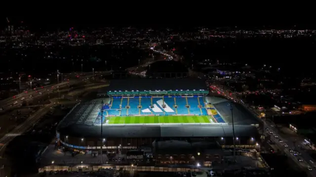 An aerial photo of a floodlit Elland Road