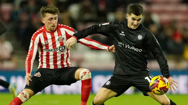 Bristol City forward Anis Mehmeti holds off the challenge of Sunderland's Dan Neil