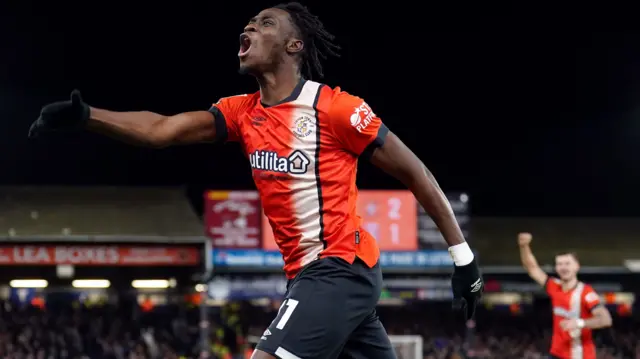 Elijah Adebayo celebrates scoring the winner for Luton against Stoke