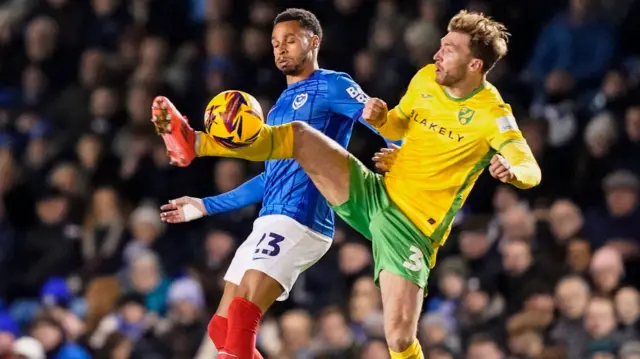 Norwich defender Jack Stacey tackles Portsmouth forward Josh Murphy