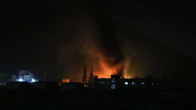 Skyline showing smoke and fire billowing on the outskirts of the Syrian capital Damascus.