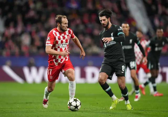 Dominik Szoboszlai of Liverpool battles for possession with Daley Blind