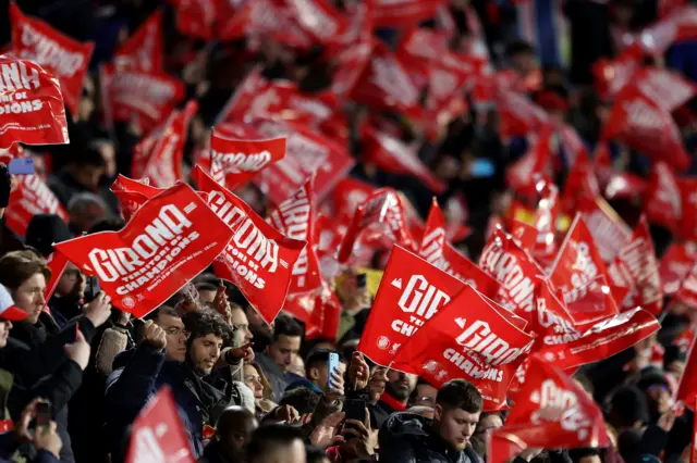 Girona fans waving flags in the stands