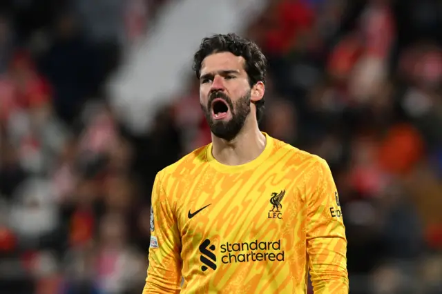 Alisson Becker of Liverpool reacts