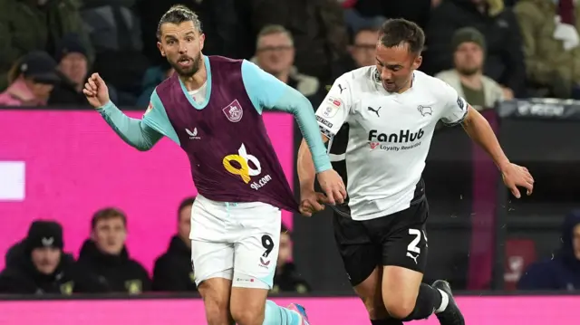 Burnley's Jay Rodriguez battles with Derby's Kane Wilson