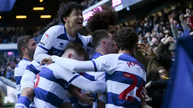 QPR players celebrate scoring against Norwich