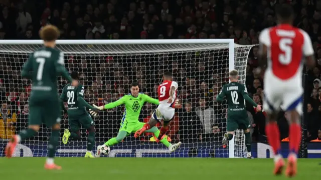 Radoslaw Majecki saves a shot from Arsenal's Brazilian striker #09 Gabriel Jesus