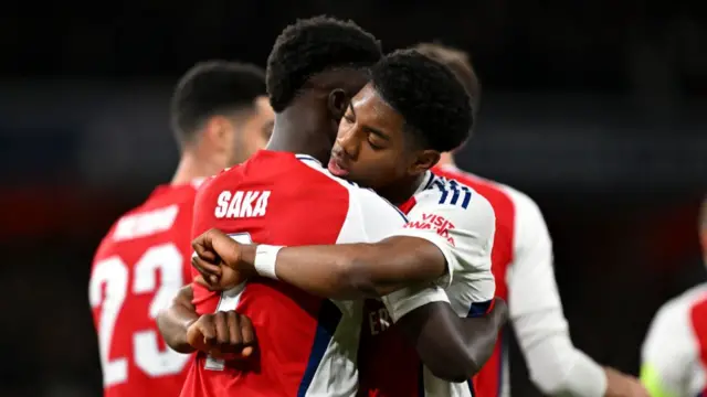 Bukayo Saka of Arsenal celebrates scoring his team's first goal with teammate Myles Lewis-Skelly