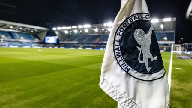 Millwall's stadium The Den under floodlights