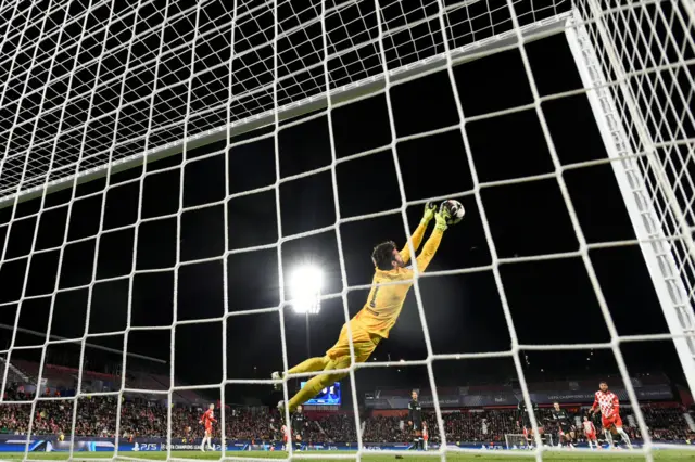 Alisson pulls off a save against Girona