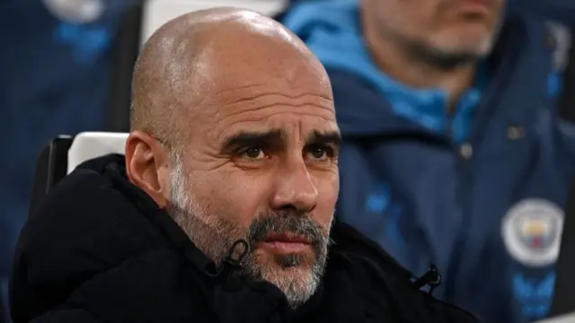 Pep Guardiola looks on