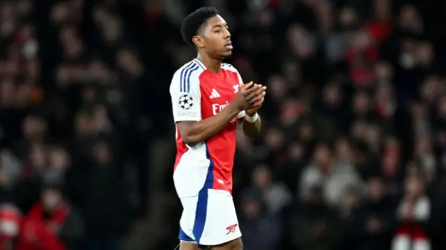 Myles Lewis-Skelly of Arsenal applauds the fans