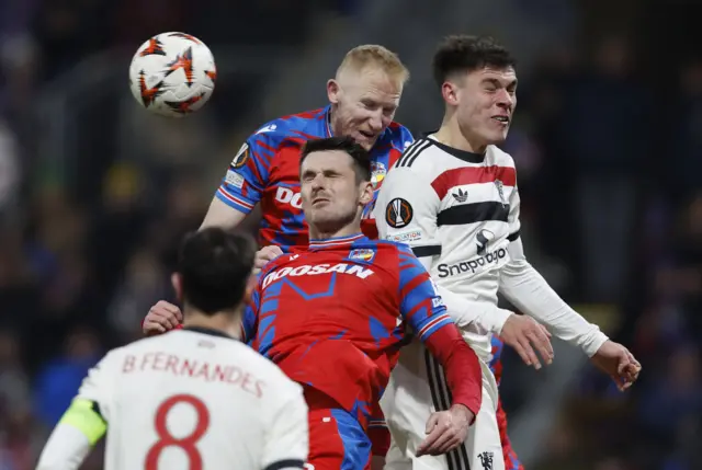 Players from both teams duel for a corner in the box