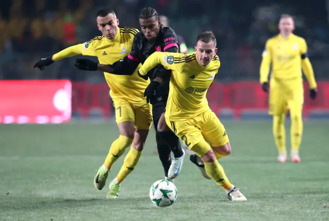 Chelsea's Carney Chukwuemeka in action with FC Astana's Max Ebong and Karlo Bartolec