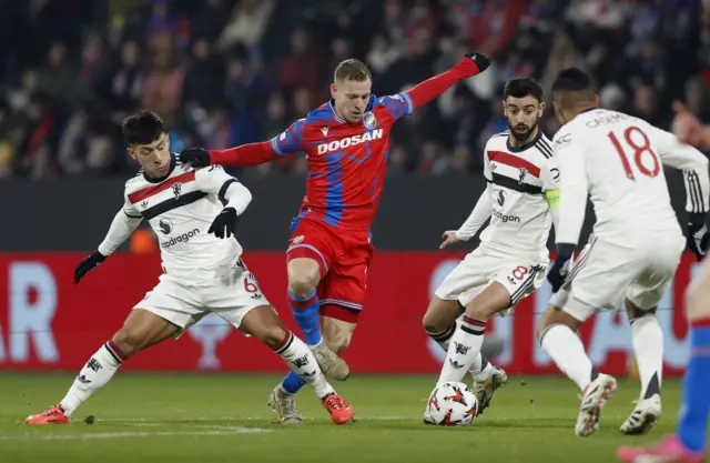 Manchester United's Bruno Fernandes and Manchester United's Lisandro Martinez in action with Viktoria Plzen's Matej Vydra