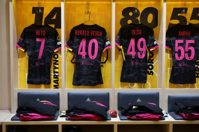 Chelsea players shirts hang ready in the dressing room
