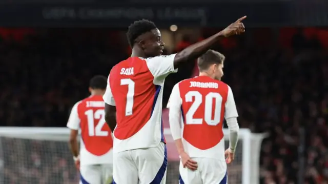 Bukayo Saka celebrates after scoring against Monaco