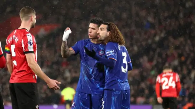 Enzo Fernandez and Marc Cucurella gesture to Jack Stephens