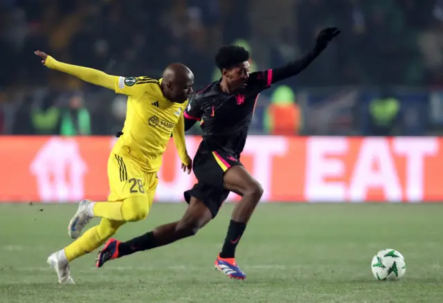FC Astana's Ousmane Camara in action with Chelsea's Samuel Rak-Sakyi