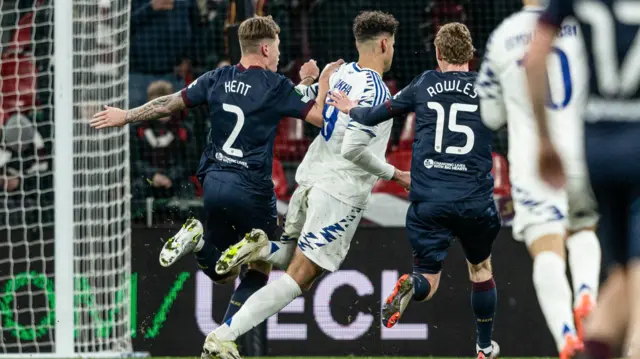 Hearts' Frankie Kent (L) and Kye Rowles (R) collide with Copenhagen's Amin Chiakha during a UEFA Conference League 2024/25 League Phase MD5 match between FC Copenhagen and Heart of Midlothian at Parken Stadium