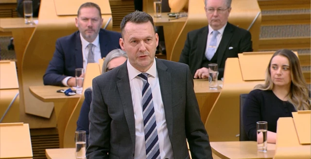 Russell Findlay address the First Minister