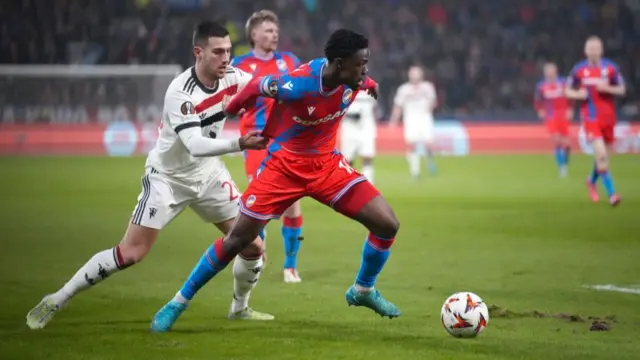 Diogo Dalot of Manchester United battles for possession with Cheick Souare of Viktoria Plzen
