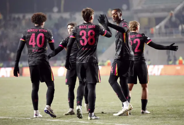 Chelsea's Renato Veiga celebrates scoring their third goal with Marc Guiu and teammates