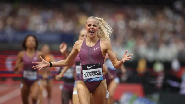 Keely Hodgkinson celebrates as she crosses the finish line at the London Diamond League in a new British record time