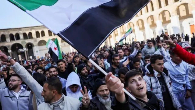 A person gestures before the first Friday prayers at the Umayyad Mosque, after fighters of the ruling Syrian body ousted Syria's Bashar al-Assad, in the Damascus old city, Syria,