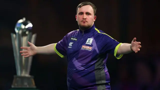 Luke Littler celebrates during the World Darts Championship final in January