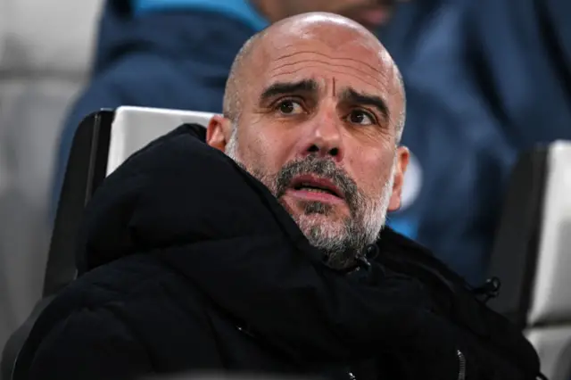 Pep Guardiola looks on