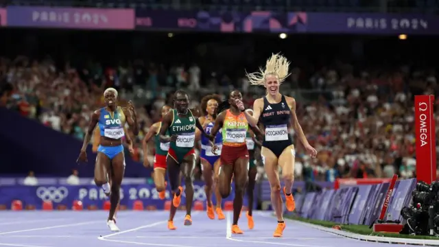 Keely Hodgkinson celebrates as she crosses the finish line in the 800m Olympic final