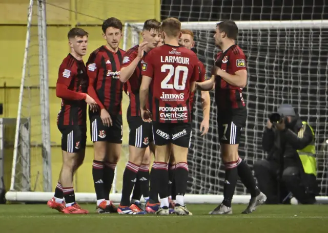 Crusaders players celebrate Jordan Forsythe's goal