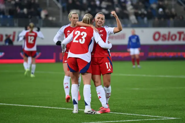 Alessia Russo celebrates with Arsenal's players