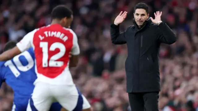 Mikel Arteta, Manager of Arsenal, reacts as Jurrien Timber of Arsenal challenges Iliman Ndiaye of Everton