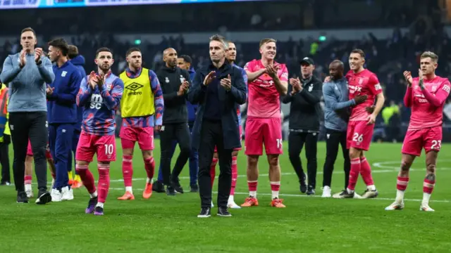 Ipswich Town manager Kieran McKenna applauds the fans with his team