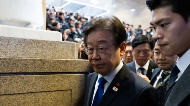 Lee Jae-myung, leader of the Democratic Party, leaves a plenary session after lawmakers passed a motion to impeach South Korean President Yoon Suk Yeol at the National Assembly in Seoul, South Korea, on Saturday, Dec. 14, 2024.