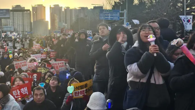 Protesters belt out a traditional, labour anthem "March for Our Beloved"