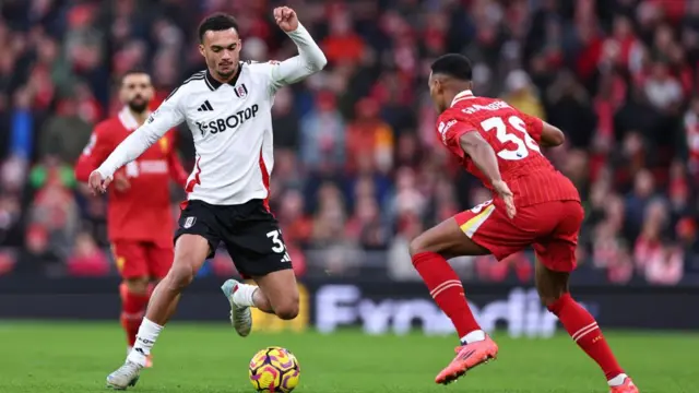 Antonee Robinson of Fulham and Ryan Gravenberch of Liverpool