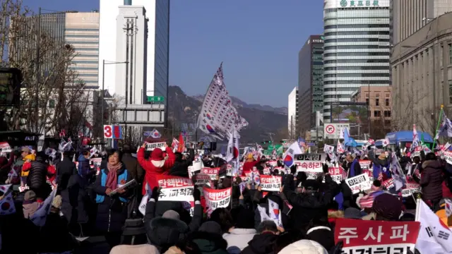 Participants at a pro-Yoon rally