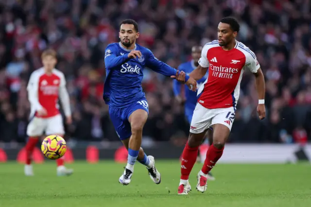 Iliman Ndiaye of Everton is challenged by Jurrien Timber of Arsenal