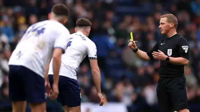 Ben Whiteman is shown a yellow card