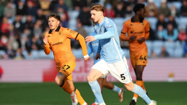 Jack Rudoni runs with the ball for Coventry