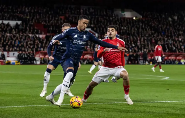 Konsa and Gibbs-White battle for the ball